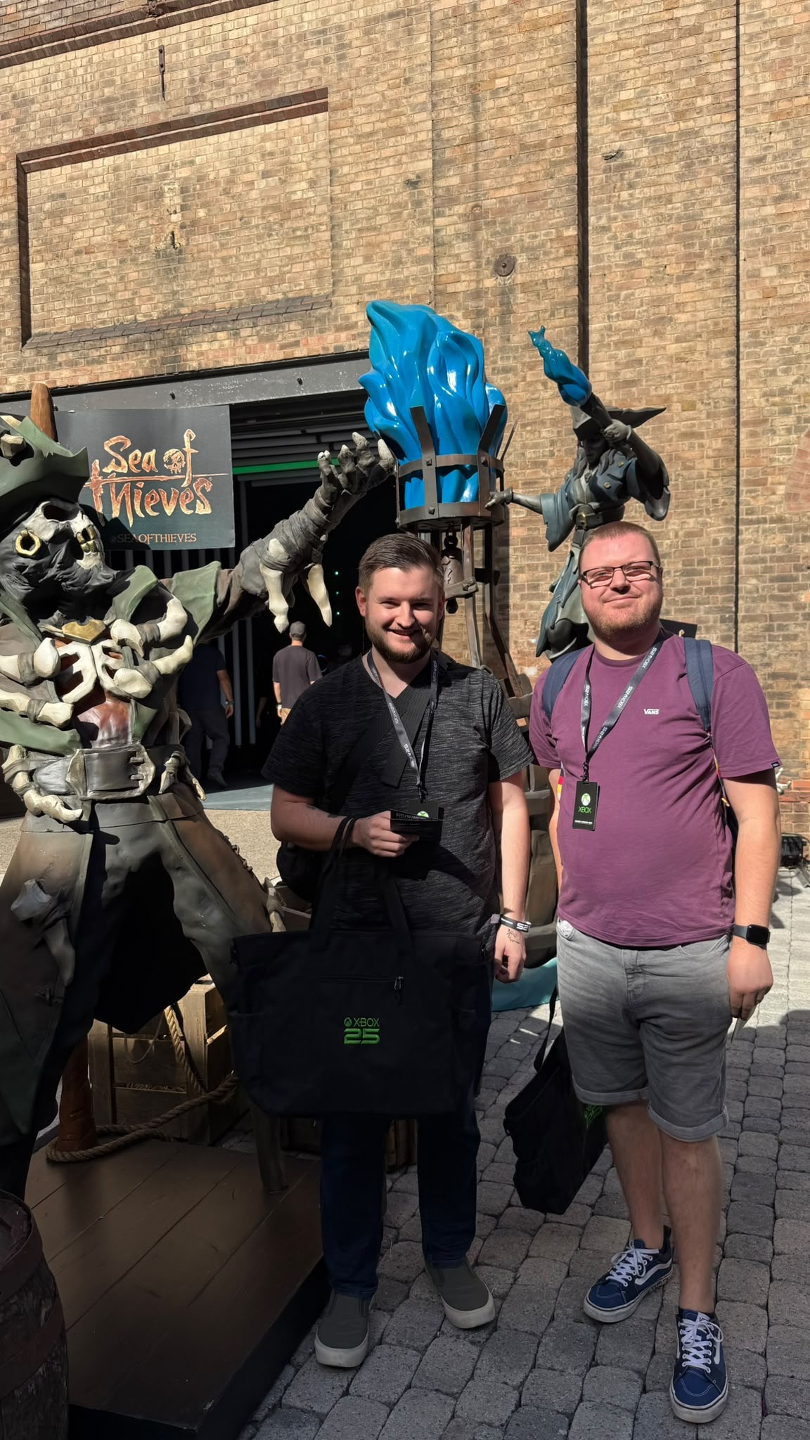 Smilar and another attendee beside a Sea of Thieves display