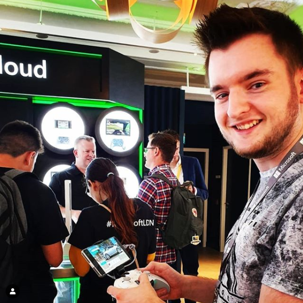 Smilar trying a controller at an xCloud event